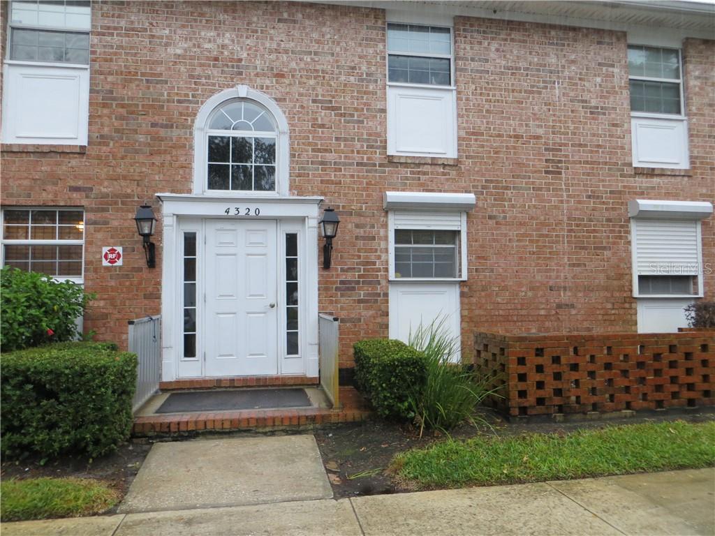 4320 Lake Underhill Road, Unit B Orlando, FL 32803 - Photo 1 of 1 a front view of a house with garden