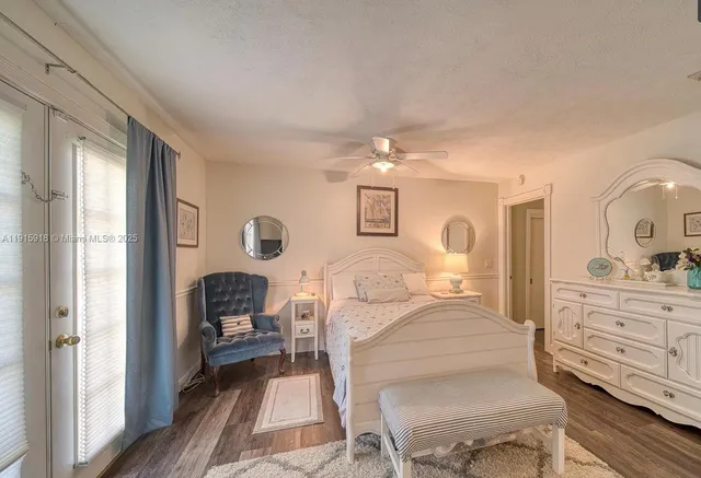 a bedroom with furniture and wooden floor
