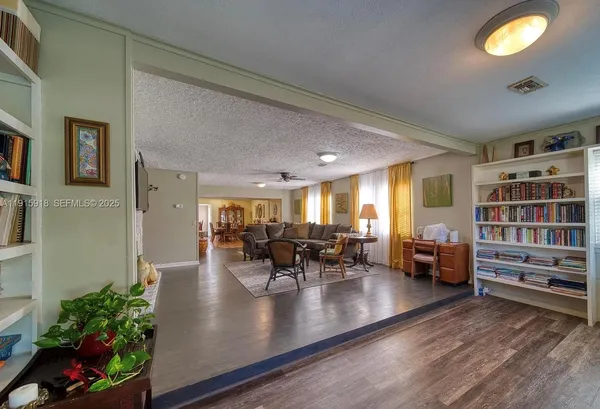 a view of a living room and dining room