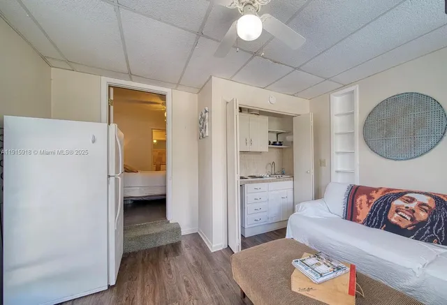 a en suite bathroom with a granite countertop sink and a mirror