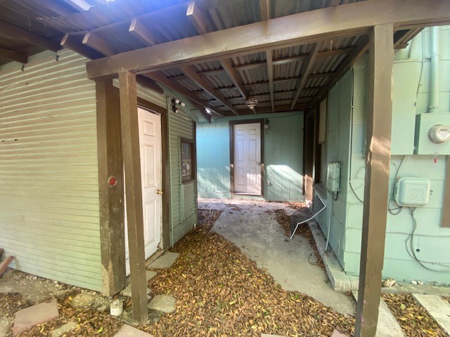 523 South Rio Grande Street Lockhart, TX 78644 - Photo 13 of 16 a view of a porch with a table and chairs