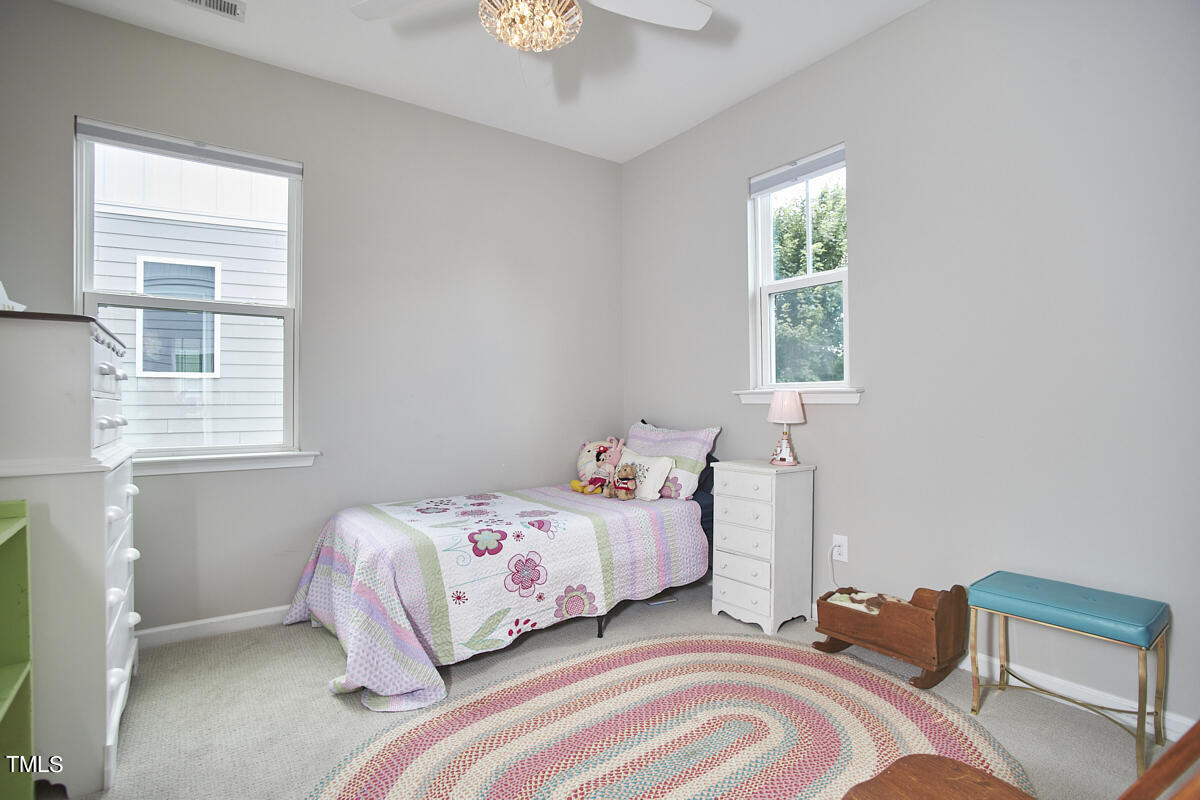 435 Plainview Avenue Raleigh, NC 27604 - Photo 26 of 35 a bedroom with a bed and a window