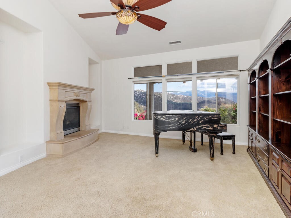 6455 Rainbow Heights Road Fallbrook, CA 92028 - Photo 24 of 63 a view of a livingroom with furniture and a ceiling fan