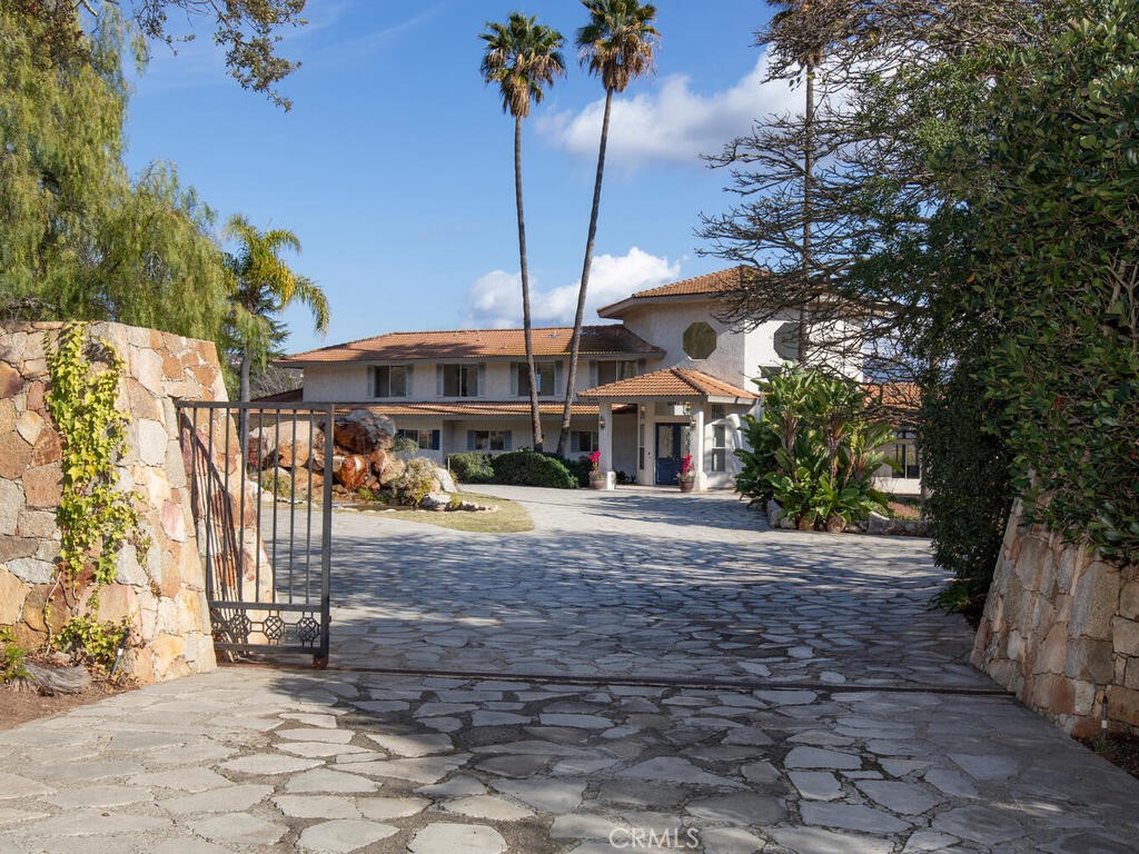 6455 Rainbow Heights Road Fallbrook, CA 92028 - Photo 3 of 63 a front view of a house with a yard