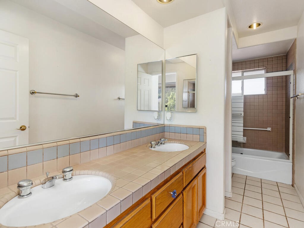 6455 Rainbow Heights Road Fallbrook, CA 92028 - Photo 37 of 63 a bathroom with a sink and a mirror