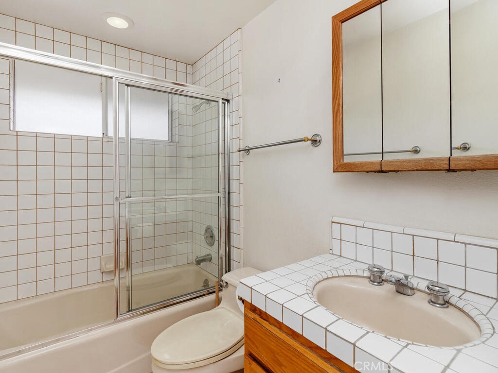 6455 Rainbow Heights Road Fallbrook, CA 92028 - Photo 39 of 63 a bathroom with a sink toilet and shower