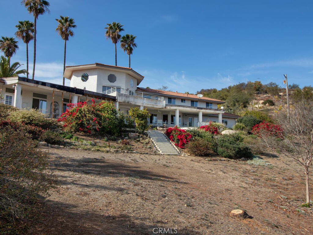 6455 Rainbow Heights Road Fallbrook, CA 92028 - Photo 45 of 63 a front view of a house with a yard