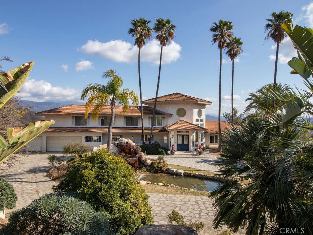 6455 Rainbow Heights Road Fallbrook, CA 92028 - Photo 5 of 63 a view of a lake with a building in the background
