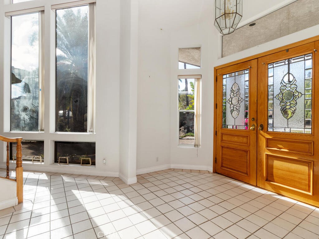 6455 Rainbow Heights Road Fallbrook, CA 92028 - Photo 9 of 63 a bedroom with a bed and a large window with balcony view