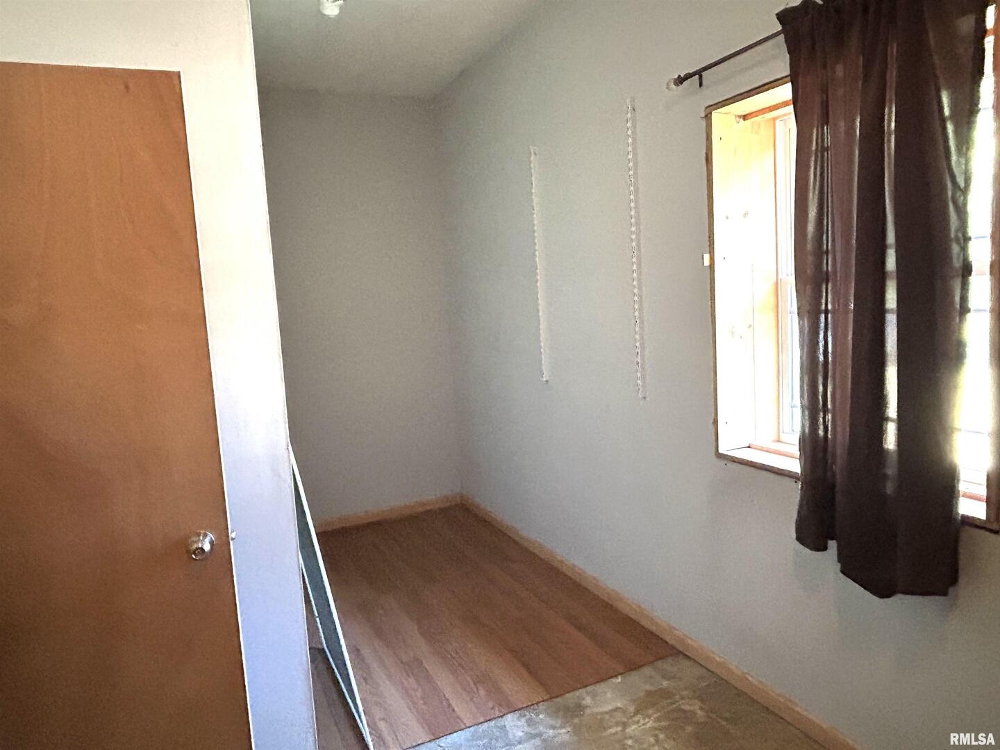 744 Cardinal Road Carbondale, IL 62901 - Photo 12 of 38 view of room with window and hardwood floor