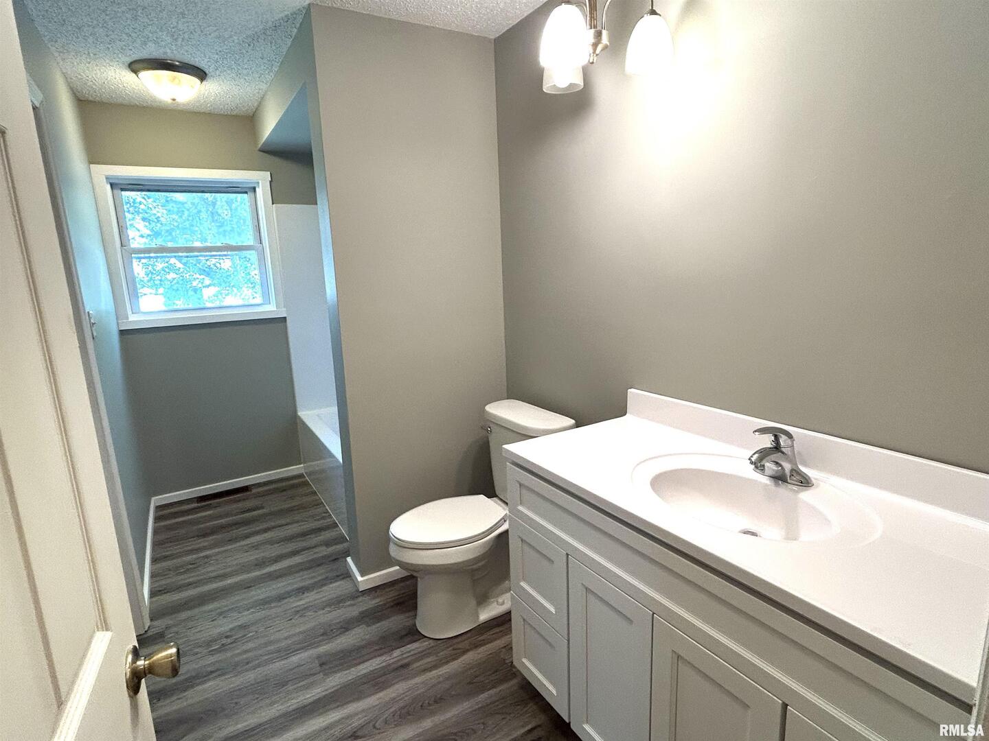 744 Cardinal Road Carbondale, IL 62901 - Photo 22 of 38 a bathroom with a sink toilet and vanity