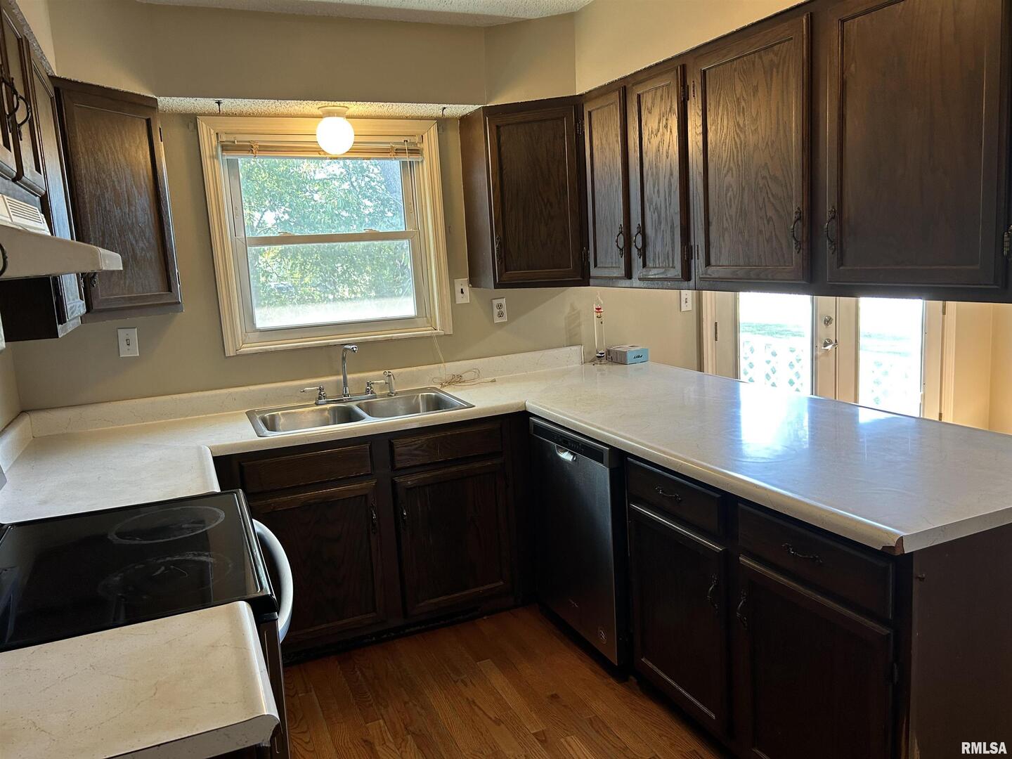 744 Cardinal Road Carbondale, IL 62901 - Photo 7 of 38 a kitchen with a sink a window and cabinets