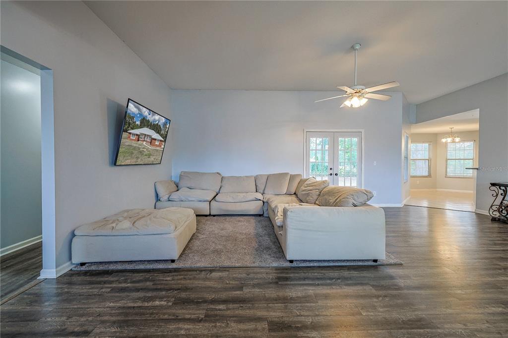 166 Southwest Hancock Court Lake City, FL 32024 - Photo 13 of 37 a living room with furniture and a wooden floor
