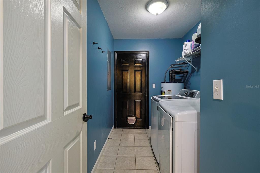166 Southwest Hancock Court Lake City, FL 32024 - Photo 15 of 37 a kitchen with a refrigerator and cabinets