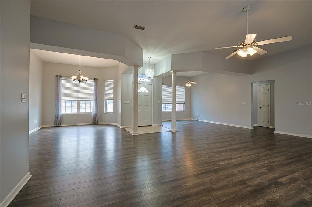166 Southwest Hancock Court Lake City, FL 32024 - Photo 20 of 46 a view of an empty room with window and wooden floor