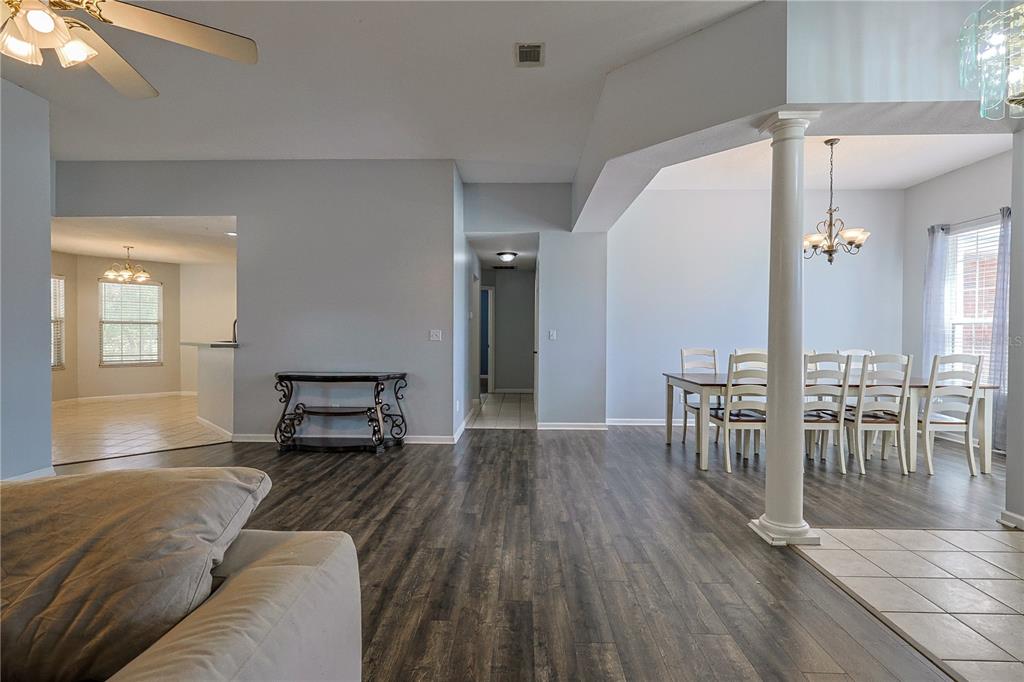 166 Southwest Hancock Court Lake City, FL 32024 - Photo 2 of 37 a living room with furniture and a wooden floor