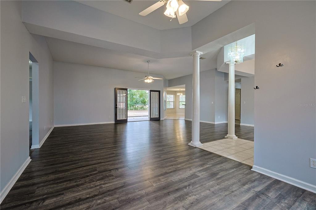 166 Southwest Hancock Court Lake City, FL 32024 - Photo 21 of 46 wooden floor in an empty room with a window