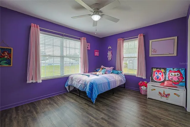 a bedroom with a bed dresser and a window