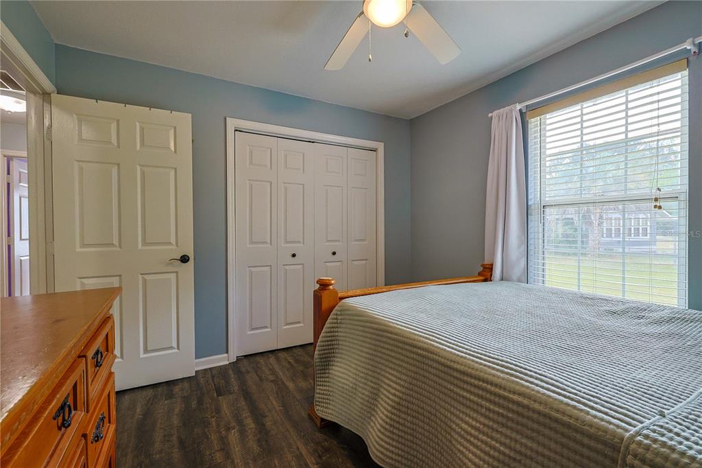 166 Southwest Hancock Court Lake City, FL 32024 - Photo 27 of 37 a bedroom with a bed and wooden floor