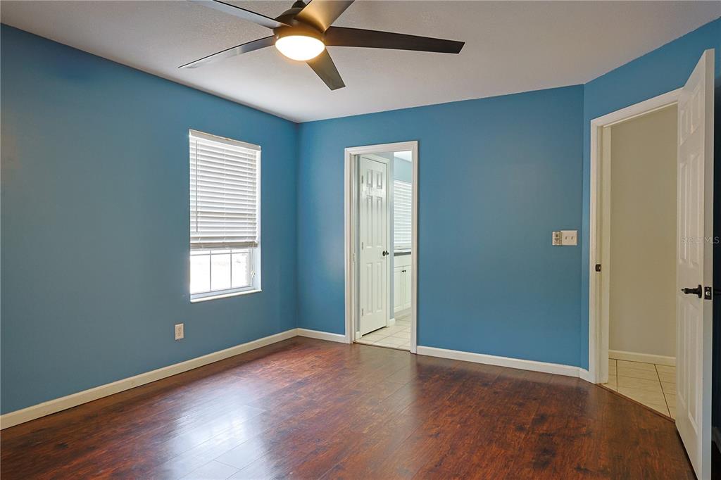 166 Southwest Hancock Court Lake City, FL 32024 - Photo 31 of 46 a view of an empty room with window and wooden floor