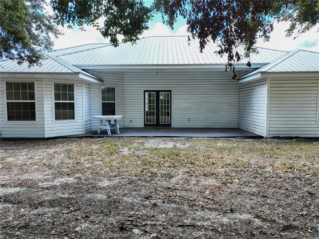 166 Southwest Hancock Court Lake City, FL 32024 - Photo 31 of 37 a view of a house with a backyard