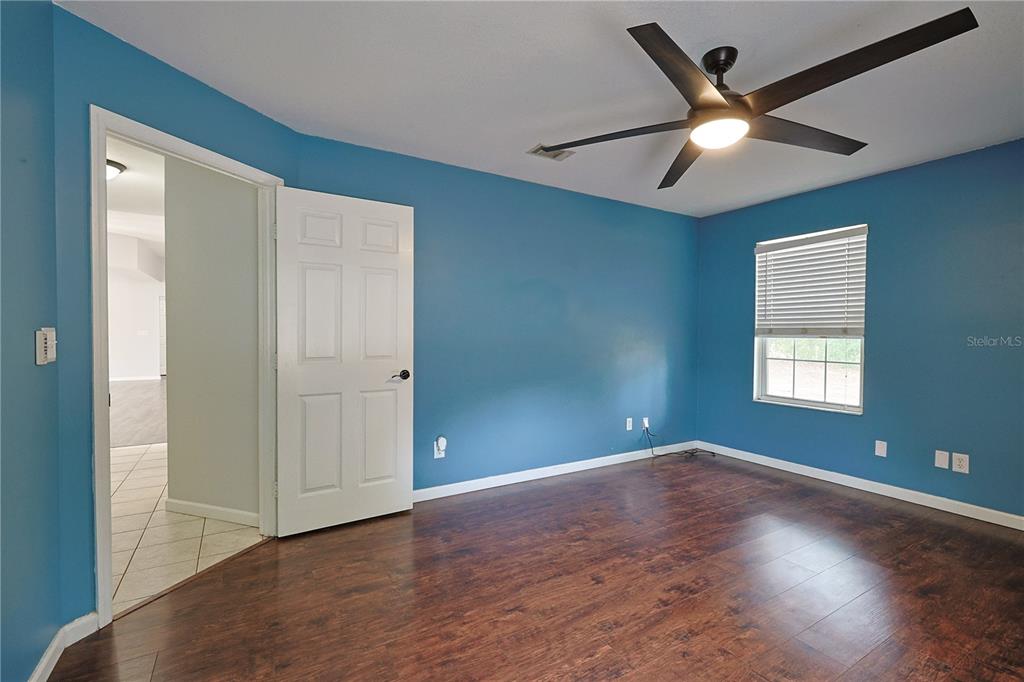 166 Southwest Hancock Court Lake City, FL 32024 - Photo 32 of 46 wooden floor in an empty room with a window