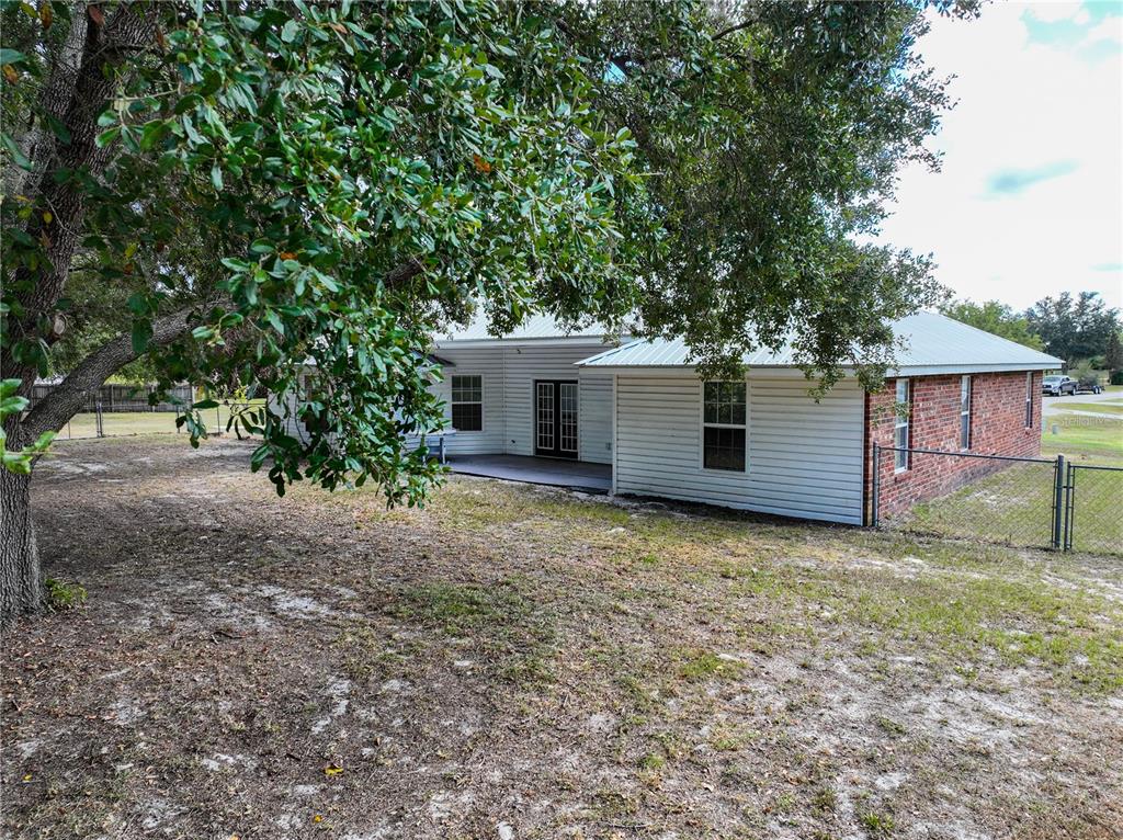 166 Southwest Hancock Court Lake City, FL 32024 - Photo 33 of 37 a view of a house with a yard