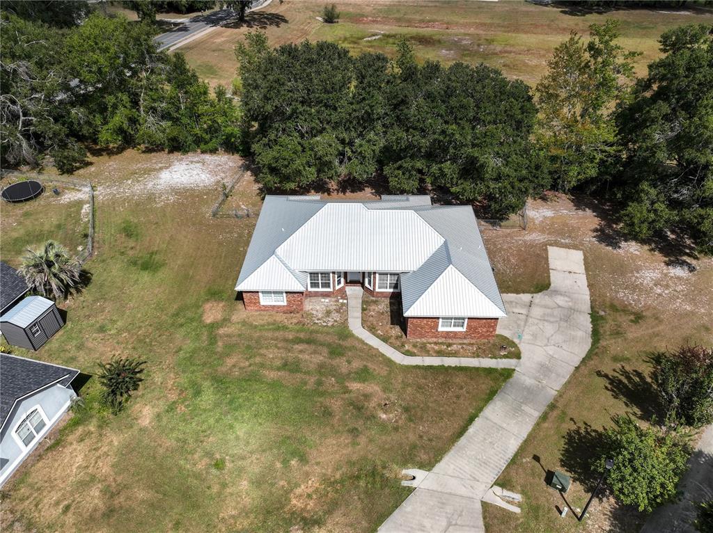 166 Southwest Hancock Court Lake City, FL 32024 - Photo 36 of 37 a view of a house with a yard