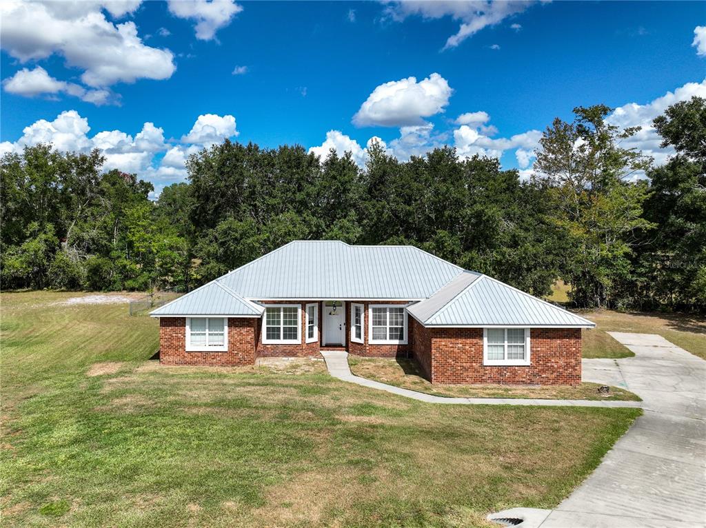 166 Southwest Hancock Court Lake City, FL 32024 - Photo 37 of 37 a front view of a house with garden