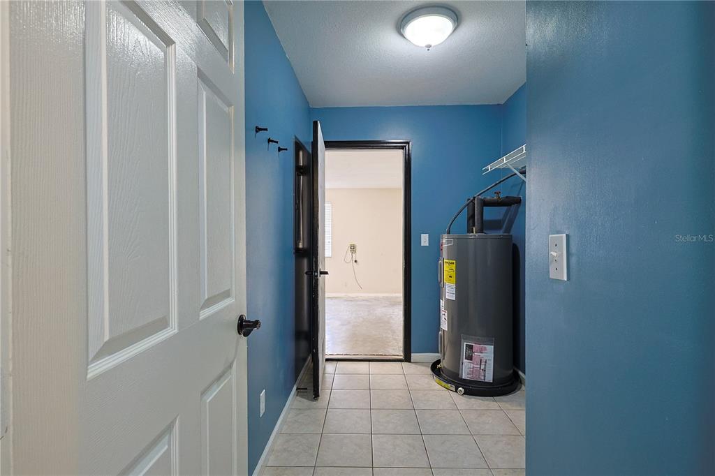 166 Southwest Hancock Court Lake City, FL 32024 - Photo 38 of 46 a view of a refrigerator in kitchen and an empty room