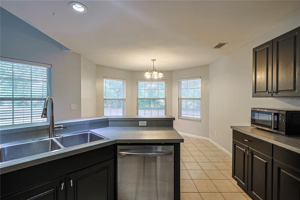 166 Southwest Hancock Court Lake City, FL 32024 - Photo 6 of 37 a kitchen with a sink and large window