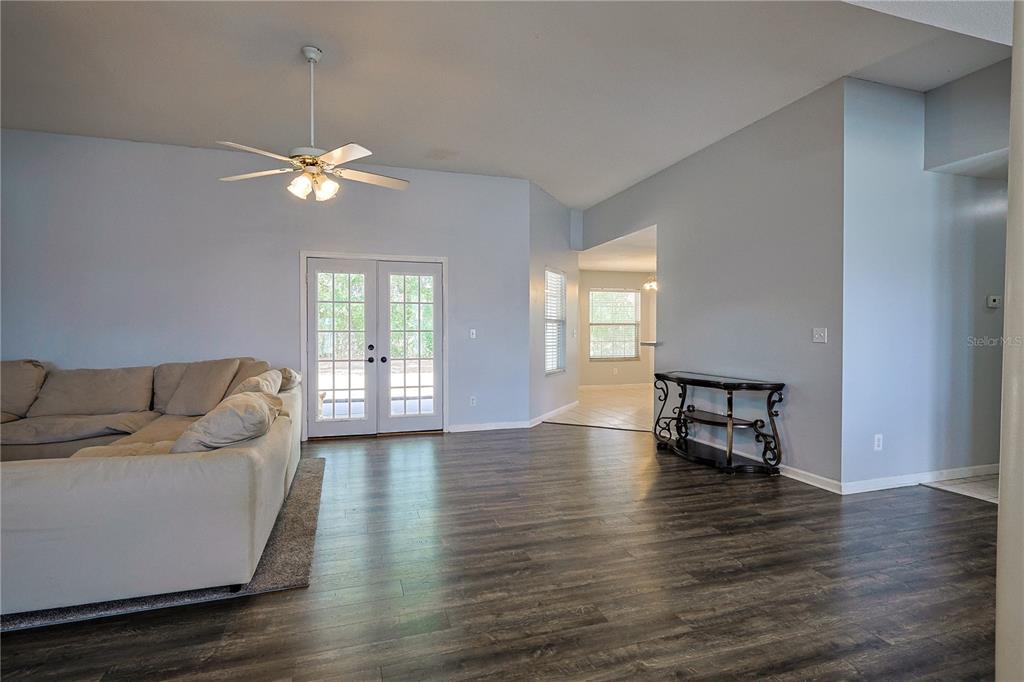 166 Southwest Hancock Court Lake City, FL 32024 - Photo 9 of 37 a living room with furniture wooden floor and a window
