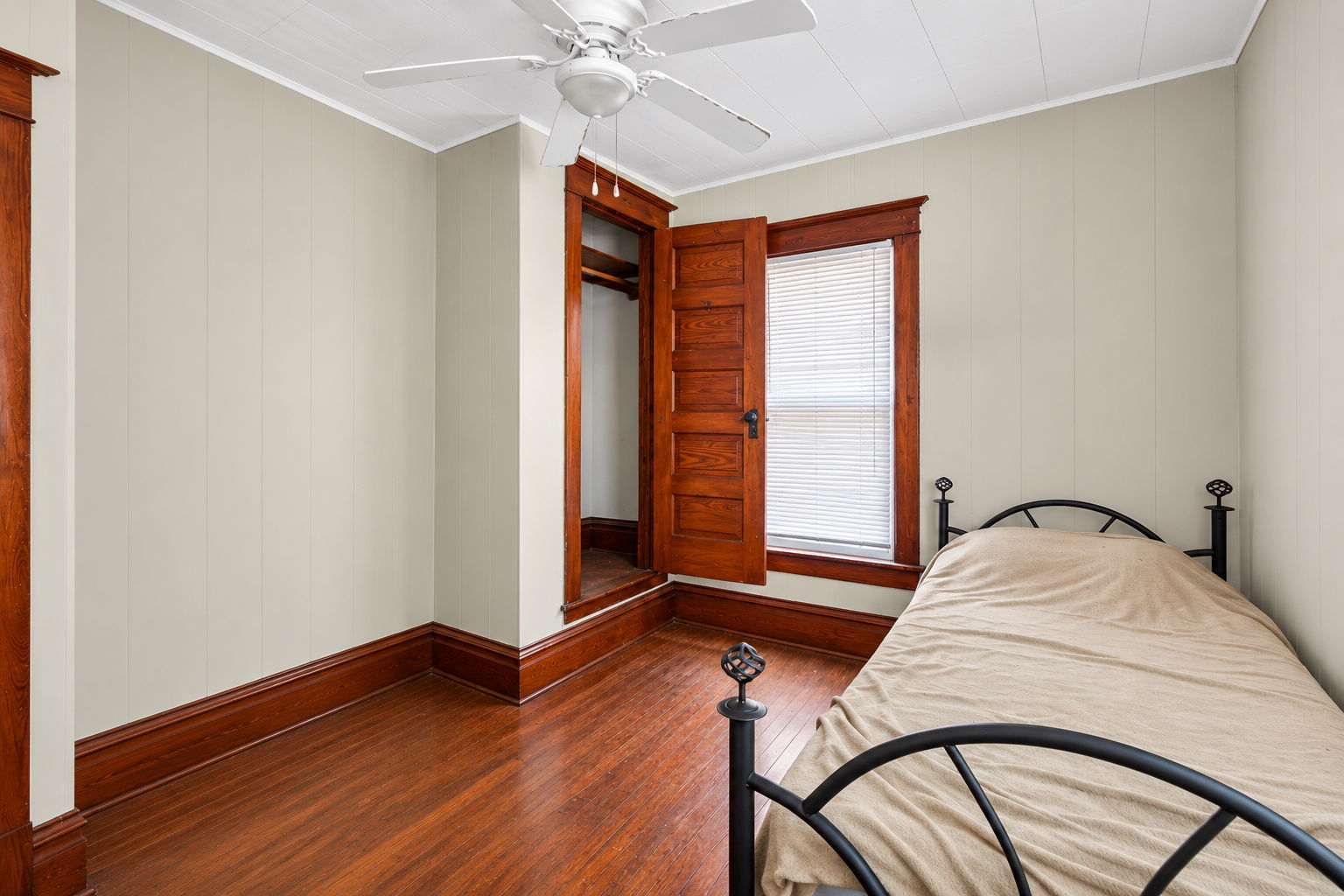 226 West Locust Street DeKalb, IL 60115 - Photo 16 of 40 a bedroom with a bed and a window