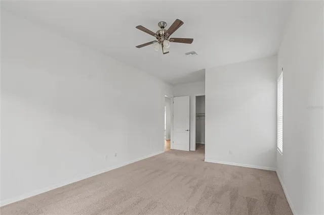 a view of a kitchen with a refrigerator and a stove
