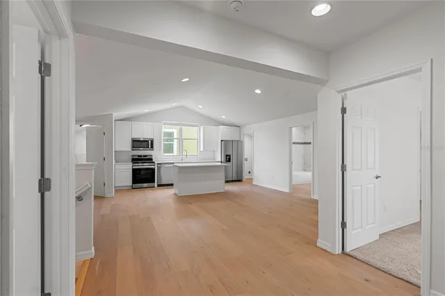 a view of an empty room with a window