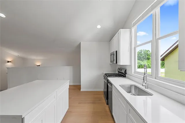 a bathroom with a sink and vanity