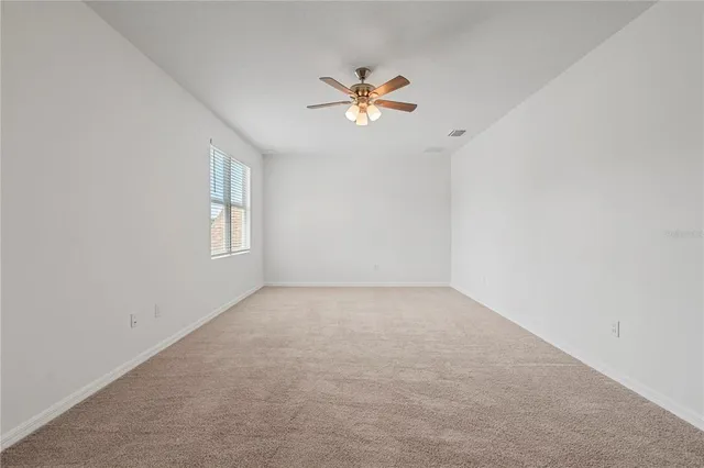 an aerial view of a house with pool
