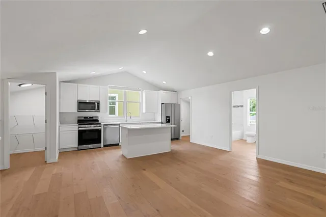 an aerial view of residential houses with outdoor space and street view