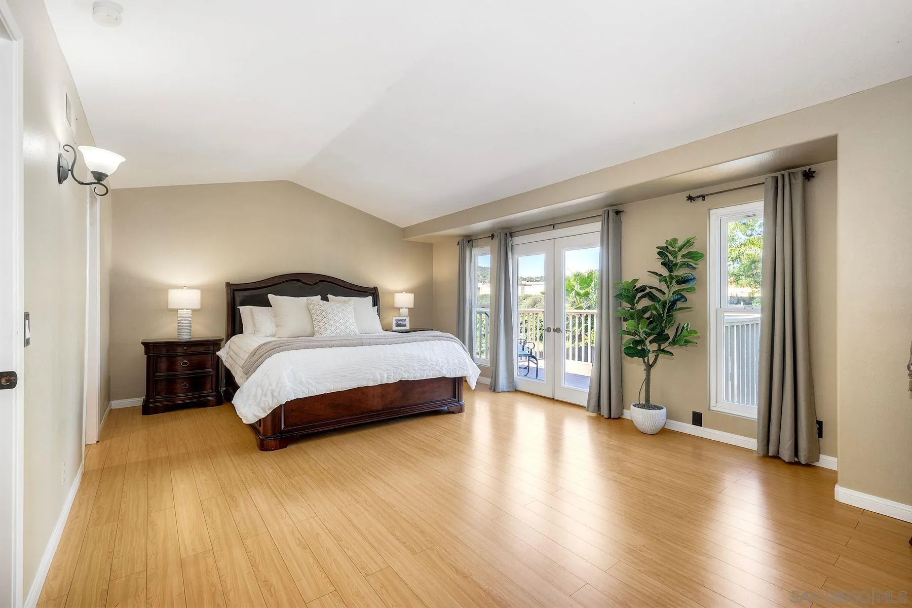 13976 Country Creek Road Poway, CA 92064 - Photo 16 of 40 a bedroom with a large bed and a large window