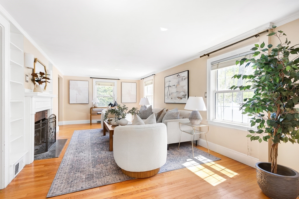 587 Greendale Avenue Needham, MA 02492 - Photo 11 of 36 a living room with furniture or couch and a fireplace