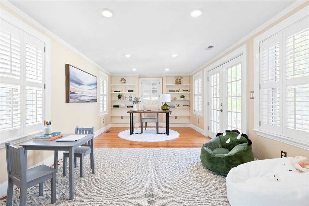 587 Greendale Avenue Needham, MA 02492 - Photo 12 of 36 a living room with fireplace furniture and a large window