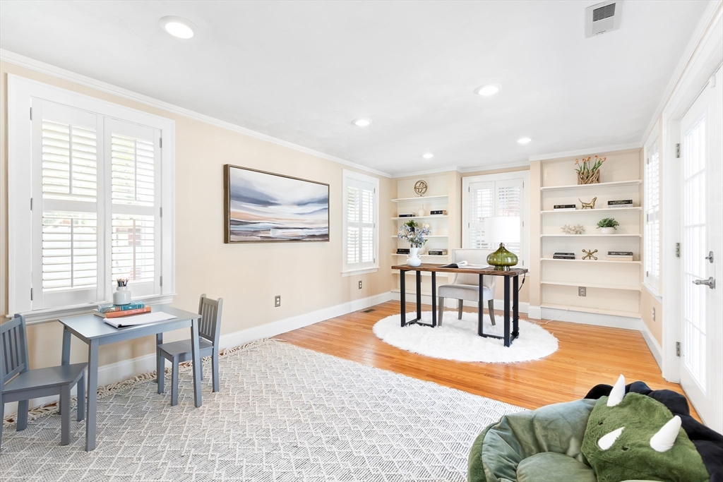 587 Greendale Avenue Needham, MA 02492 - Photo 13 of 36 a living room with furniture and a dining table with kitchen view