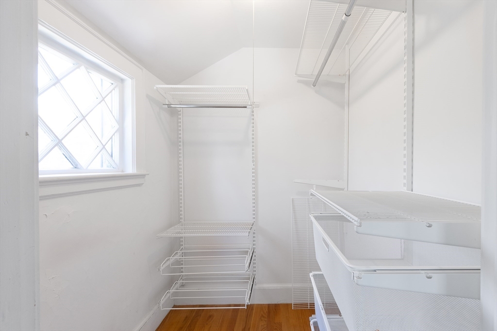 587 Greendale Avenue Needham, MA 02492 - Photo 19 of 36 a bathroom with a tub and window