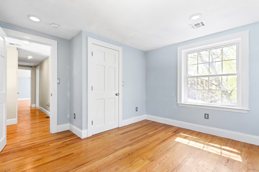 587 Greendale Avenue Needham, MA 02492 - Photo 23 of 36 a view of a livingroom with wooden floor and a window
