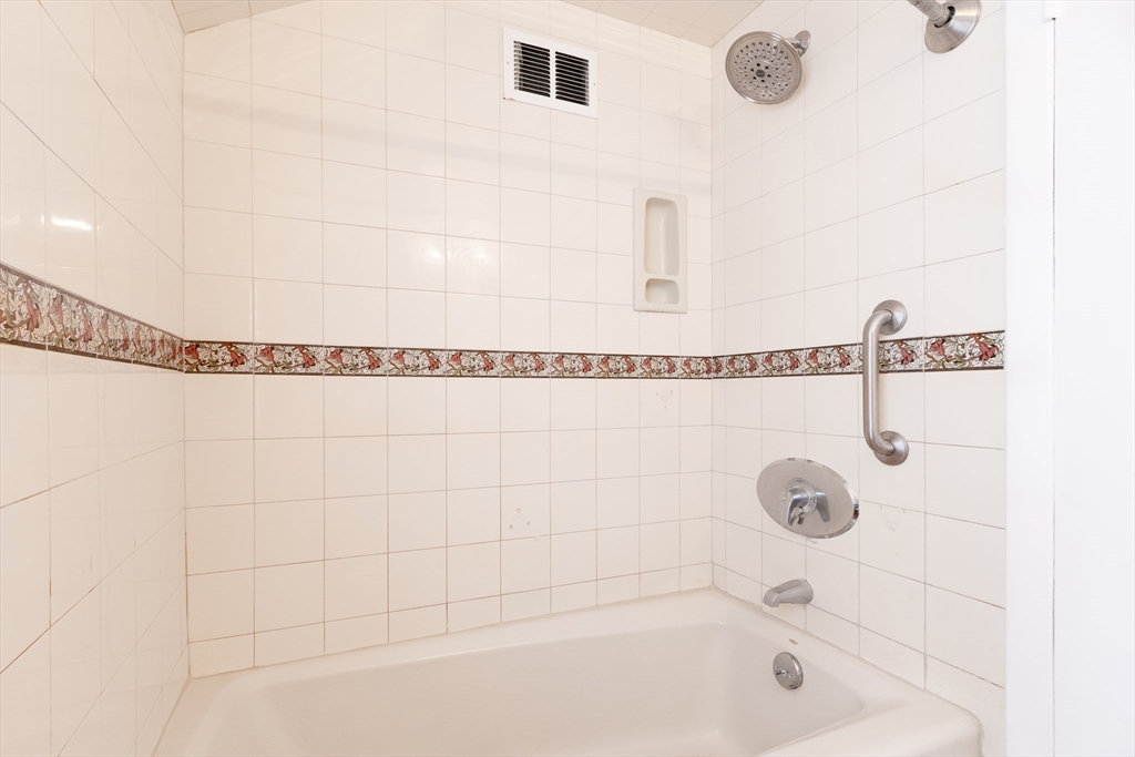 587 Greendale Avenue Needham, MA 02492 - Photo 27 of 36 a bathroom with a shower and a shower