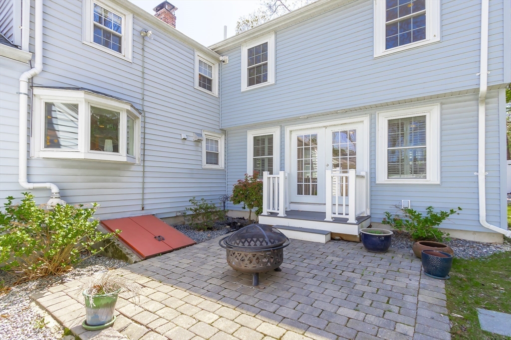 587 Greendale Avenue Needham, MA 02492 - Photo 28 of 36 a backyard of a house with outdoor seating
