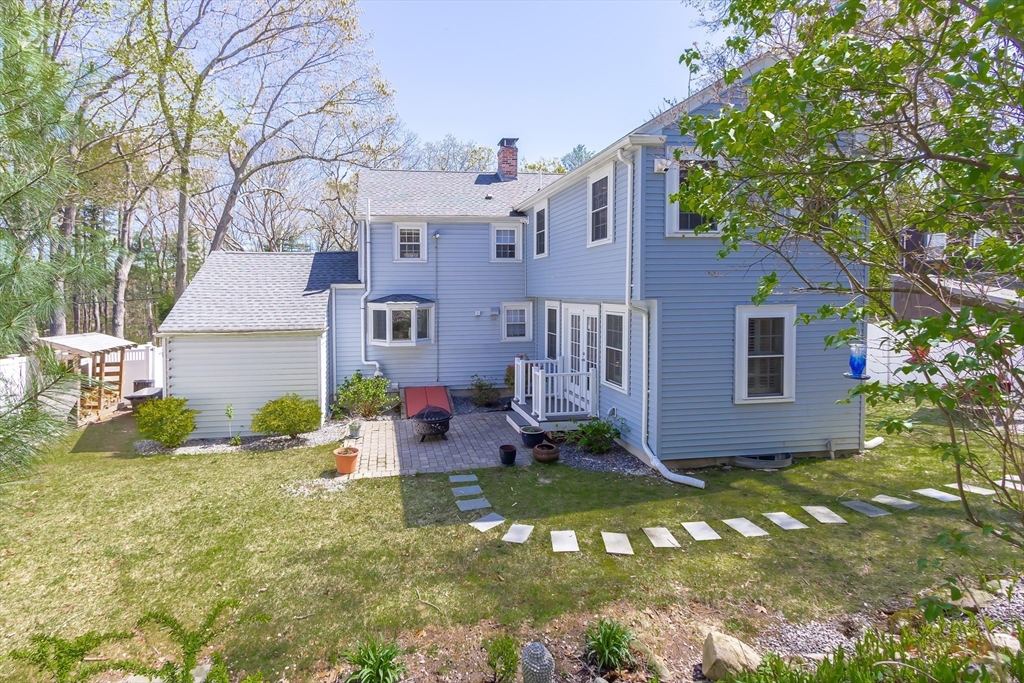 587 Greendale Avenue Needham, MA 02492 - Photo 31 of 36 front view of a house with a yard