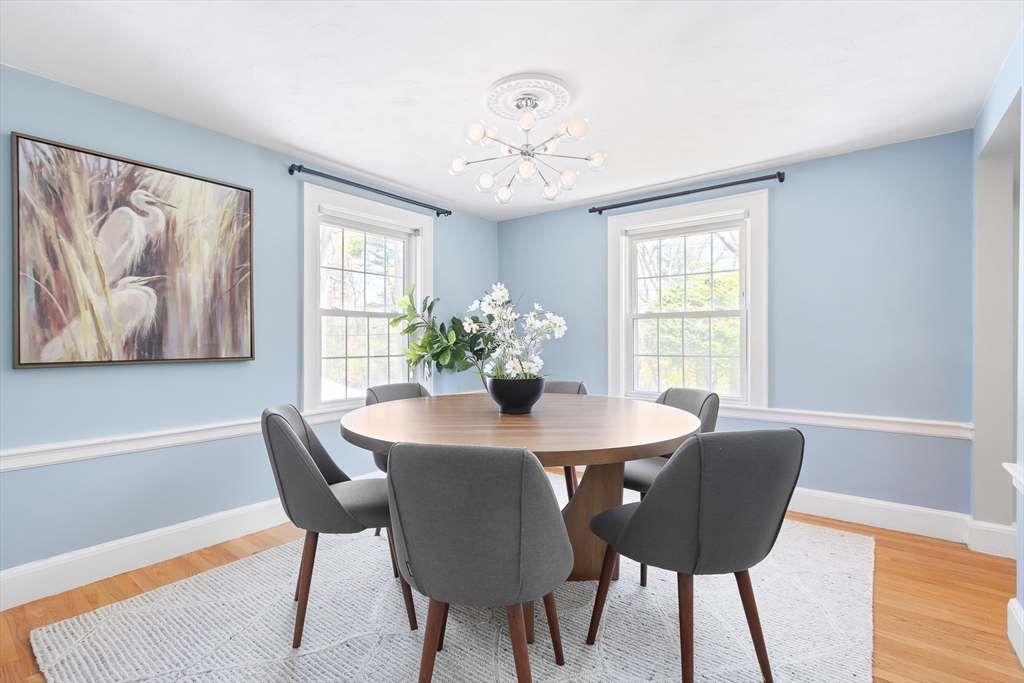 587 Greendale Avenue Needham, MA 02492 - Photo 6 of 36 a view of a dining room with furniture window and wooden floor