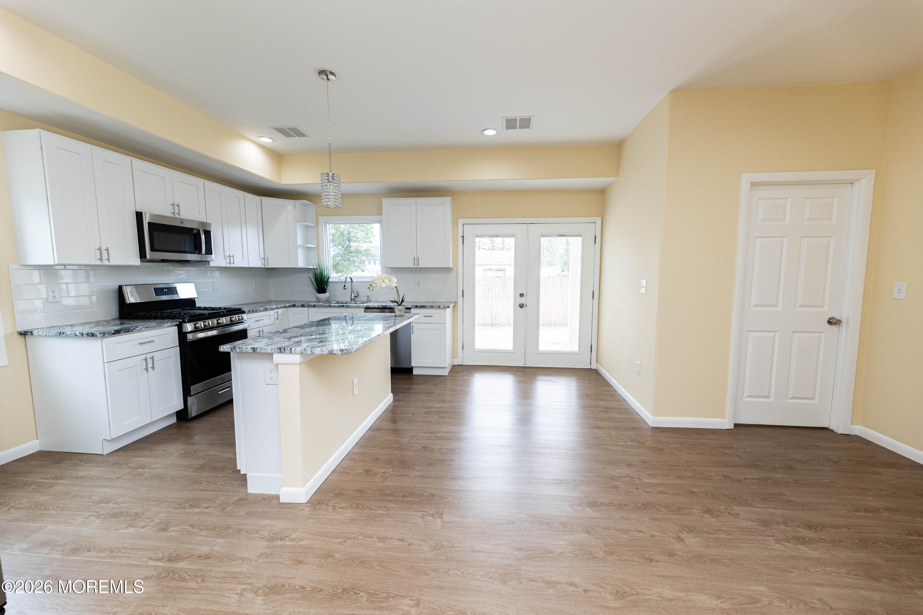 2408 Herbertsville Road Point Pleasant, NJ 08742 - Photo 15 of 82 a large kitchen with a center island and stainless steel appliances