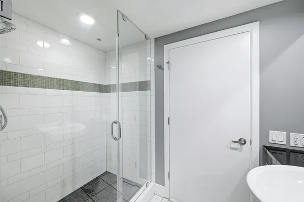 a bathroom with a shower and a toilet